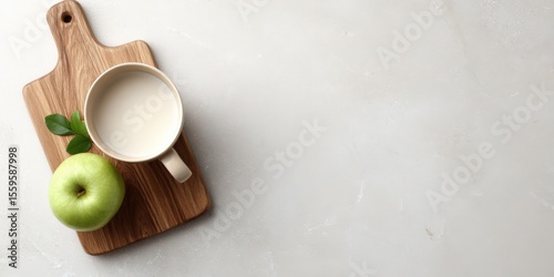Healthy snack: green milk cup, on wooden board, marble background, healthy eating