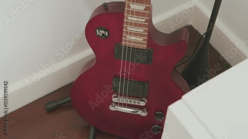 Classic red electric guitar shines with timeless rock appeal