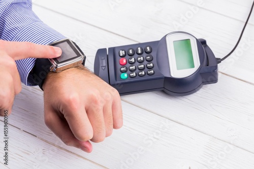 Man using smart watch to express pay