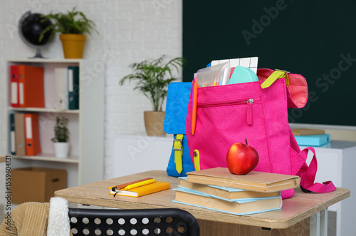 Backpacks with books and ap...