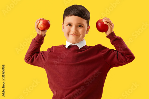 Little schoolboy with apple...