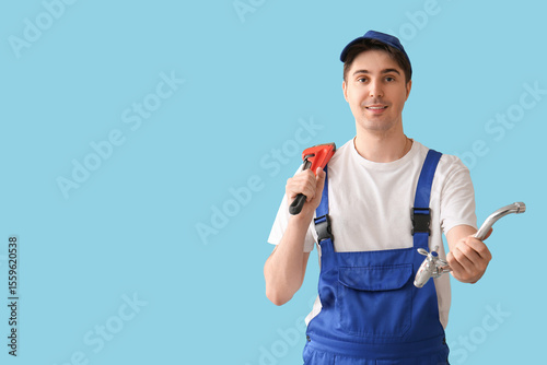 Male plumber with pipe wren...