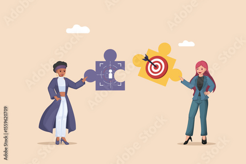 Businesswomen connecting puzzle pieces to find a perfect customer segment or marketing target, illustrating strategic business development and market analysis.