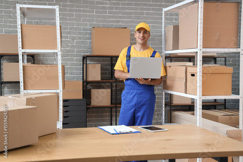 Delivery man working with l...