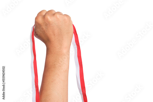 Konstfotografi Human hand holding a red and white ribbon as a symbol of the Indonesian flag iso