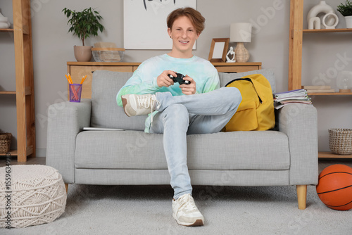 Male student playing video ...