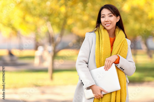 Beautiful young happy Asian...