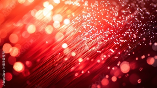 Abstract red fiber optic cables glowing with bokeh lights.