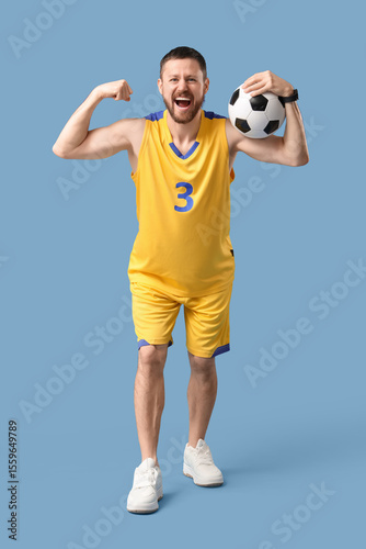 Happy male footballer with ...