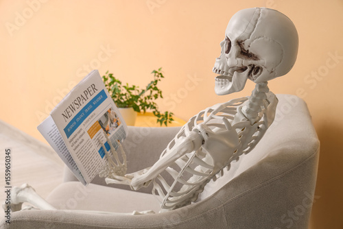 Skeleton with newspaper sit...
