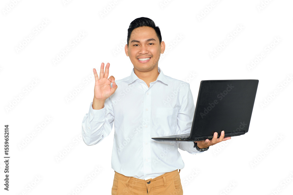Portrait of happy young Asian man in formal wear holding laptop and showing ok sign, looking at camera with smile isolated on transparent background Portrait of happy young Asian man in formal wear holding laptop and showing ok sign, looking at camera with smile isolated on transparent background