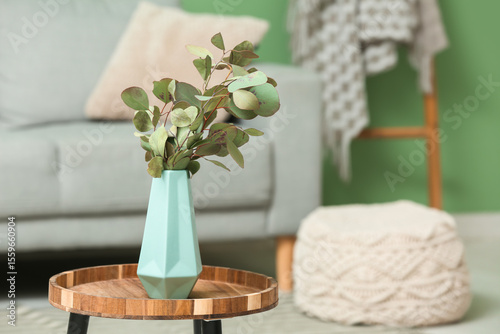 Blue vase with eucalyptus b...