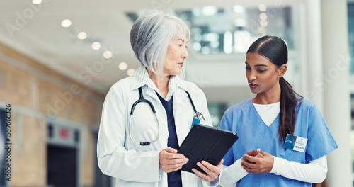 Women, nurse or doctor with tablet for research discussion or healthcare mentorship at hospital. Female people, intern or medical worker with technology for staff training on telehealth app at clinic