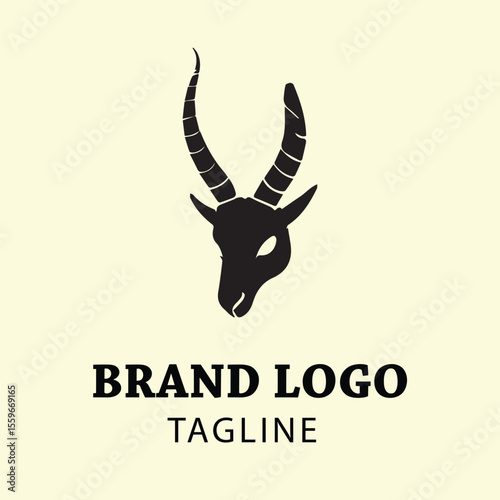 Black silhouette of a goat head logo design with brand name and tagline. Simple, stylized image of goat head with long horns in a minimalist design.