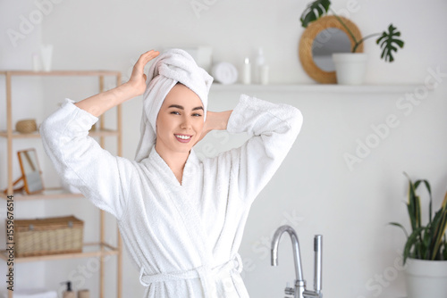 Young woman in soft bathrob...