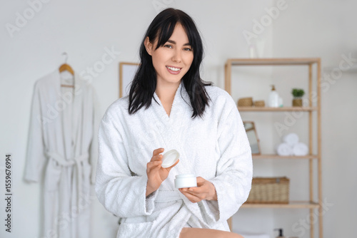 Young woman in soft bathrob...