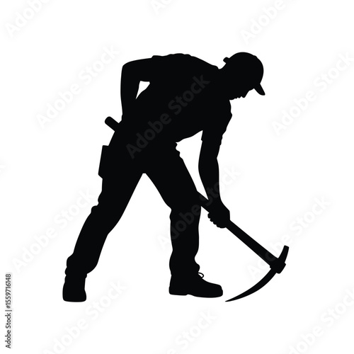 Silhouette of a manual worker using a pickaxe on white background