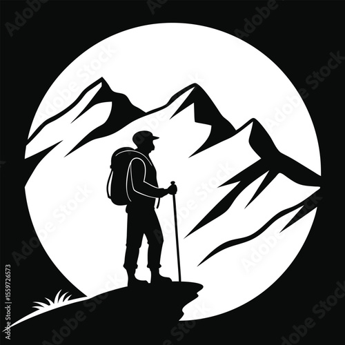Silhouette of a Hiker Standing on a Mountaintop Against a Snowy Mountain Range Under a Full Moon