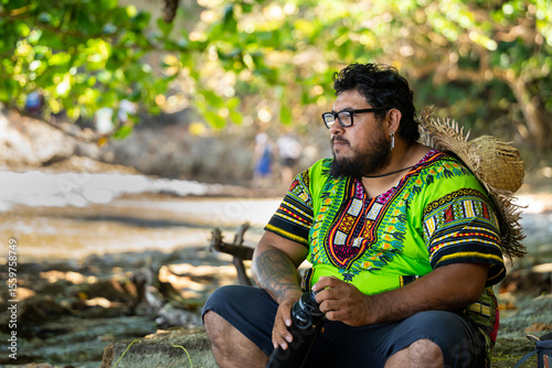 Costa Rican tourist resting on a tropical beach in Cahuita National Park in Costa Rica