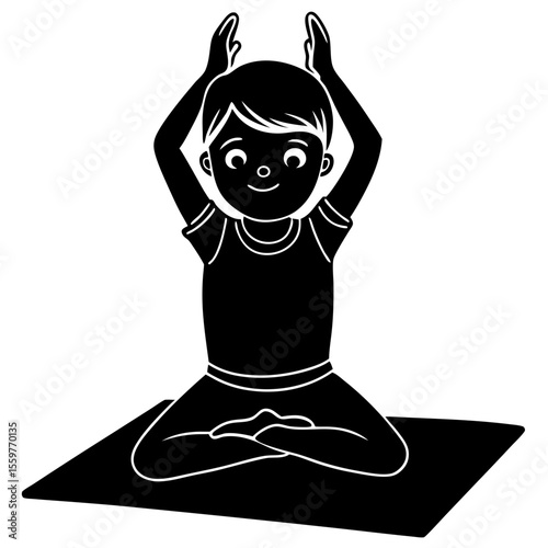 Happy young boy in silhouette meditating in lotus pose on yoga mat