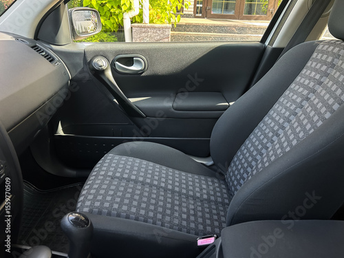 Wallpaper Mural The interior of a compact car showcases comfortable upholstery combined with modern design features, making it an ideal choice for daily commuting and enjoyable travel experiences Torontodigital.ca