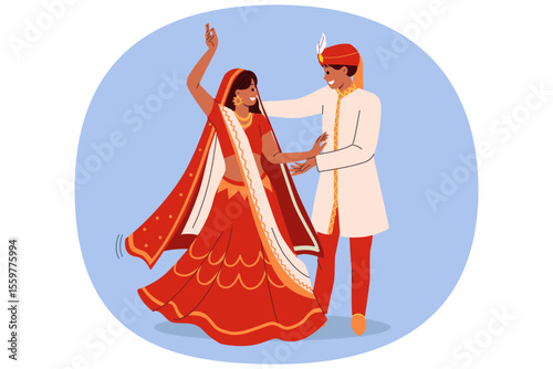 Indian couple dances wedding dance in national clothes, performing traditional rite of hindi culture. Wedding ceremony of indian bride and groom rejoicing in creation of new family