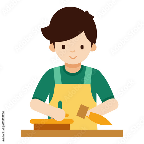 Young boy wearing apron and working with clay on a table