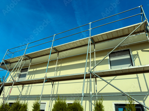 The scaffolding structure supports various renovation projects, creating a safer environment for workers while enhancing the development process with its versatility and durability