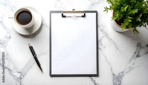 Blank clipboard with clean white paper placed on a marble table