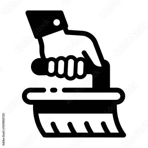 Glyph icon depicting a cleaning hand brush 
