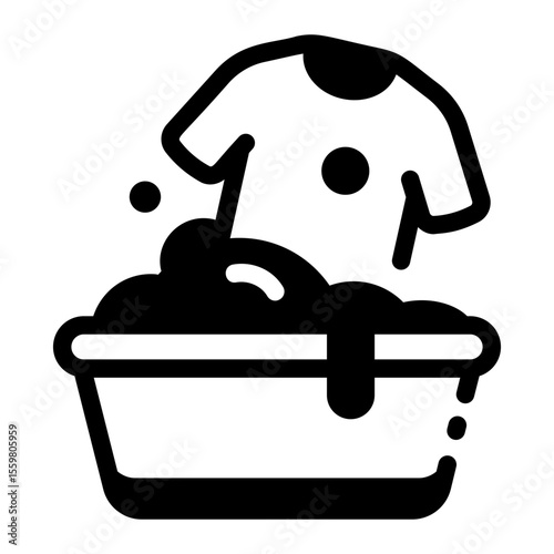 A glyph style icon showing washing shirt