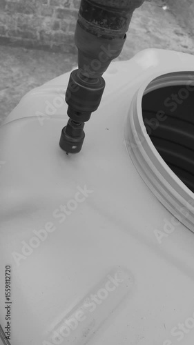Detailed Drilling Process On Water Tank Surface.