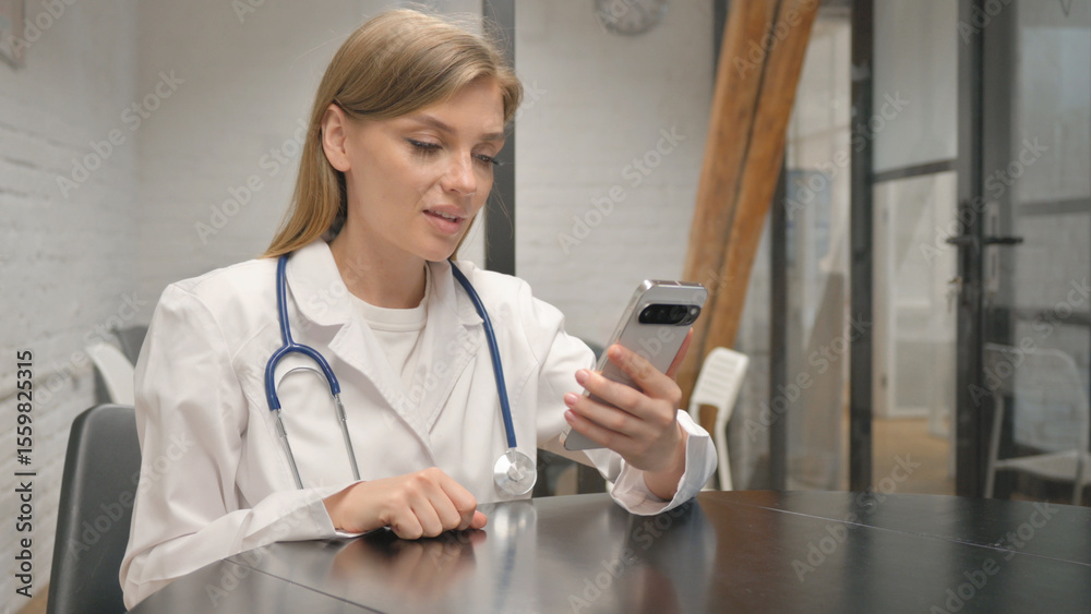 Young Female Doctor Doing Video Chat on Phone Young Female Doctor Doing Video Chat on Phone