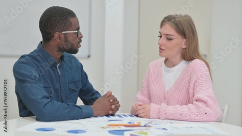Close up of Woman Talking With Male Colleague