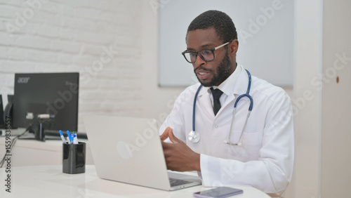 African American Doctor Talking for Video Call on Laptop
