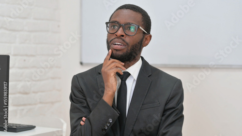 Tableau sur toile Brainstorming Young African Businessman Deep in Thought
