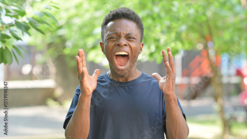 Slika na platnu Screaming and Shouting Casual African Man Outdoors