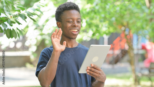 Casual African Man Making a Video Call on a Tablet