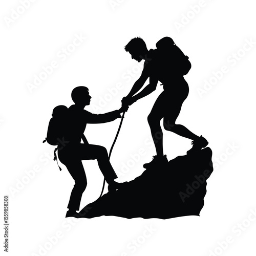 Silhouette of two hikers helping each other ascend a rocky peak