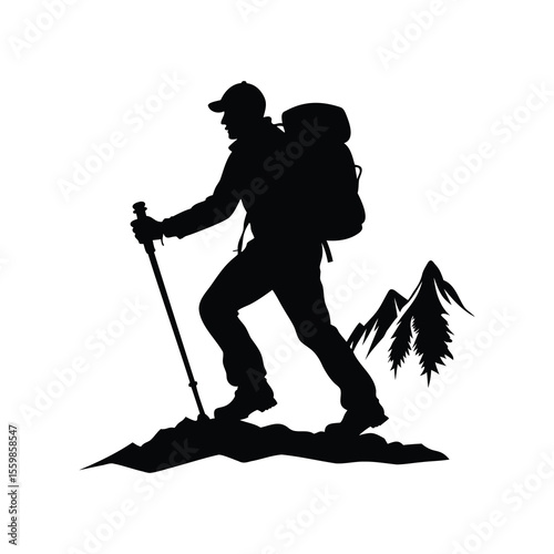 Silhouette of a hiker with backpack in mountainous terrain conquering nature