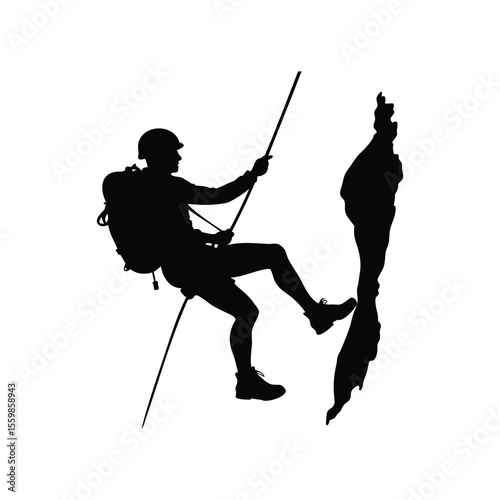 Silhouette of a rock climber rappelling down a cliff face safely