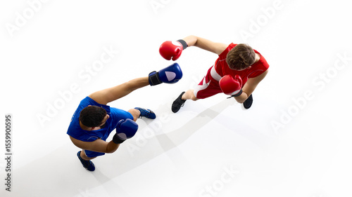 Tableau sur toile Two athletes are sparring in a boxing ring, one in blue gear and the other in red, viewed from an aerial perspective