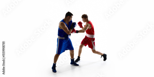 Two boxers facing off in action poses on a white background, showcasing athleticism and intensity. Concept of competitive spirit and sportsmanship in boxing. photo