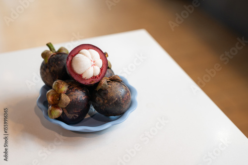 Mangosteen Fruits on a Blue Plate