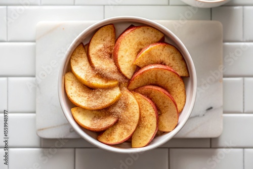 Delicious Air Fryer Baked Apple Slices with Cinnamon and Sugar Served in a Bowl