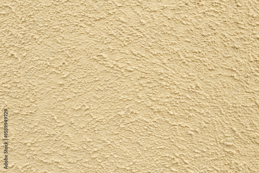 A detailed closeup reveals the textured surface of a pale beige wall A detailed closeup reveals the textured surface of a pale beige wall