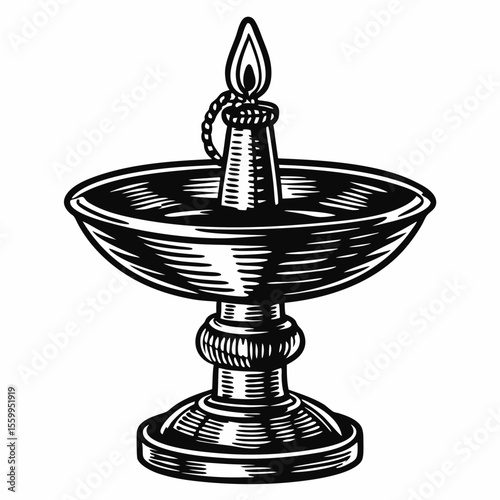 Traditional oil lamp with a flame on a decorative base for celebration  