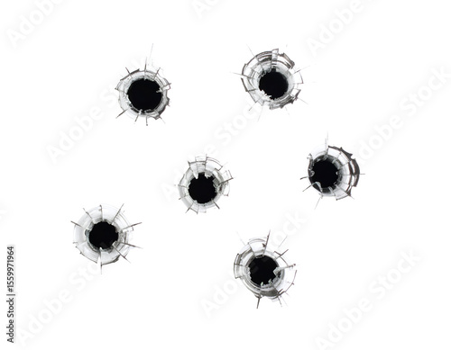 Six impactful bullet holes shatter clear glass, creating a powerful visual of damage and force.