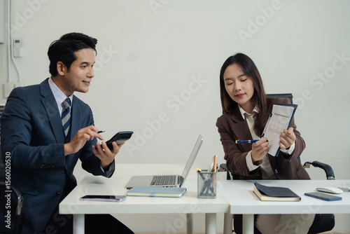 Business corporate team brainstorming, planning strategy having a discussion Analysis investment researching with chart at office desk documents in office.