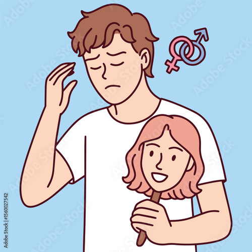 Sad young man holds smiling female mask while struggling with gender identity and inner conflict, symbolizing gender dysphoria and emotional distress